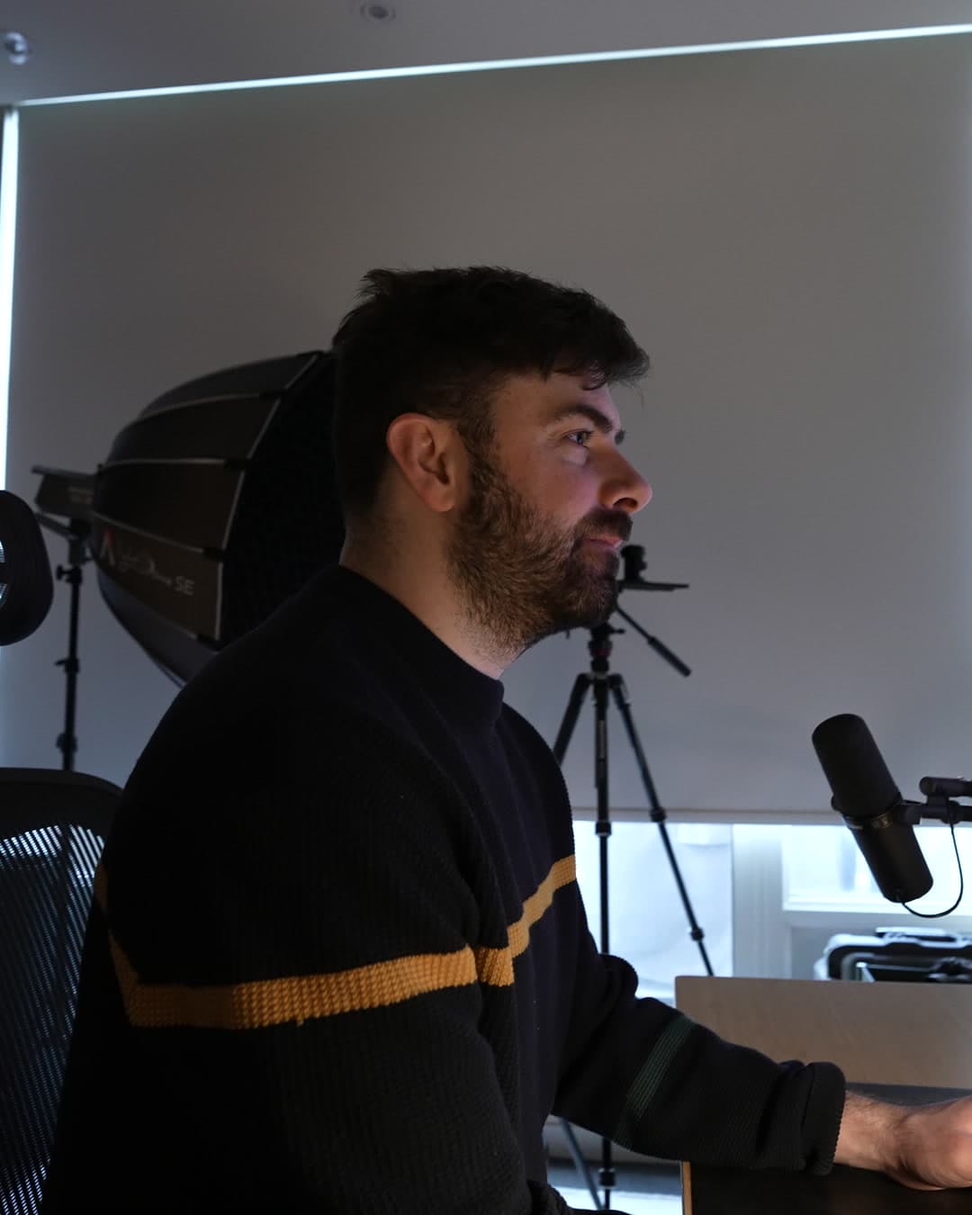 Justin DeMarchi recording at his desk